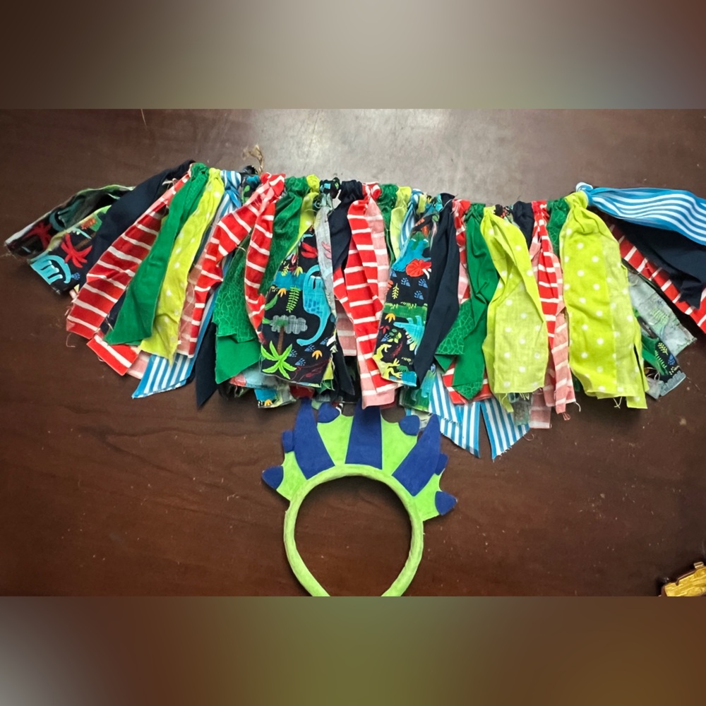 Handmade dinosaur apron for high‎ chair for a baby birthday and ears.